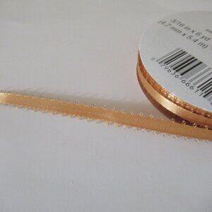 18 yds loop-edged satiny gold ribbon